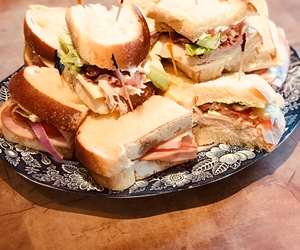 Small assorted sandwich platter on fresh country white bread.