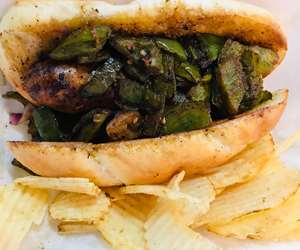 Housemade Sausage and Peppers, served on a hoagie roll.