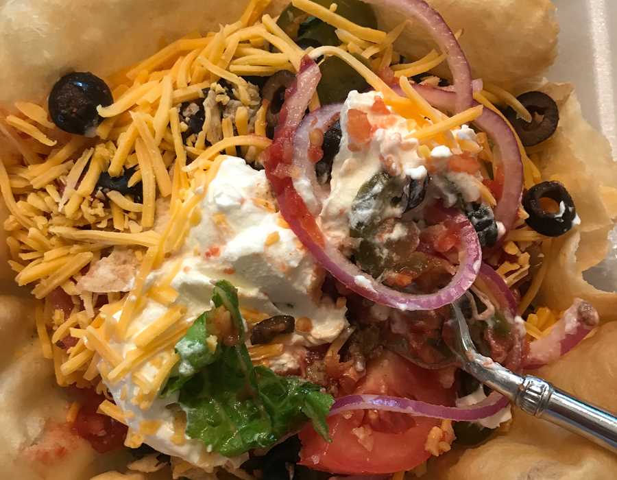 A Taco Salad with the works, served in a taco shell. A Taco Tuesday favorite.